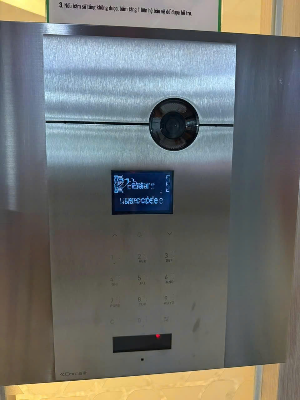 Comelit 3452HD 3ONE6 Sense HD lobby panel with scrambled, unreadable display characters