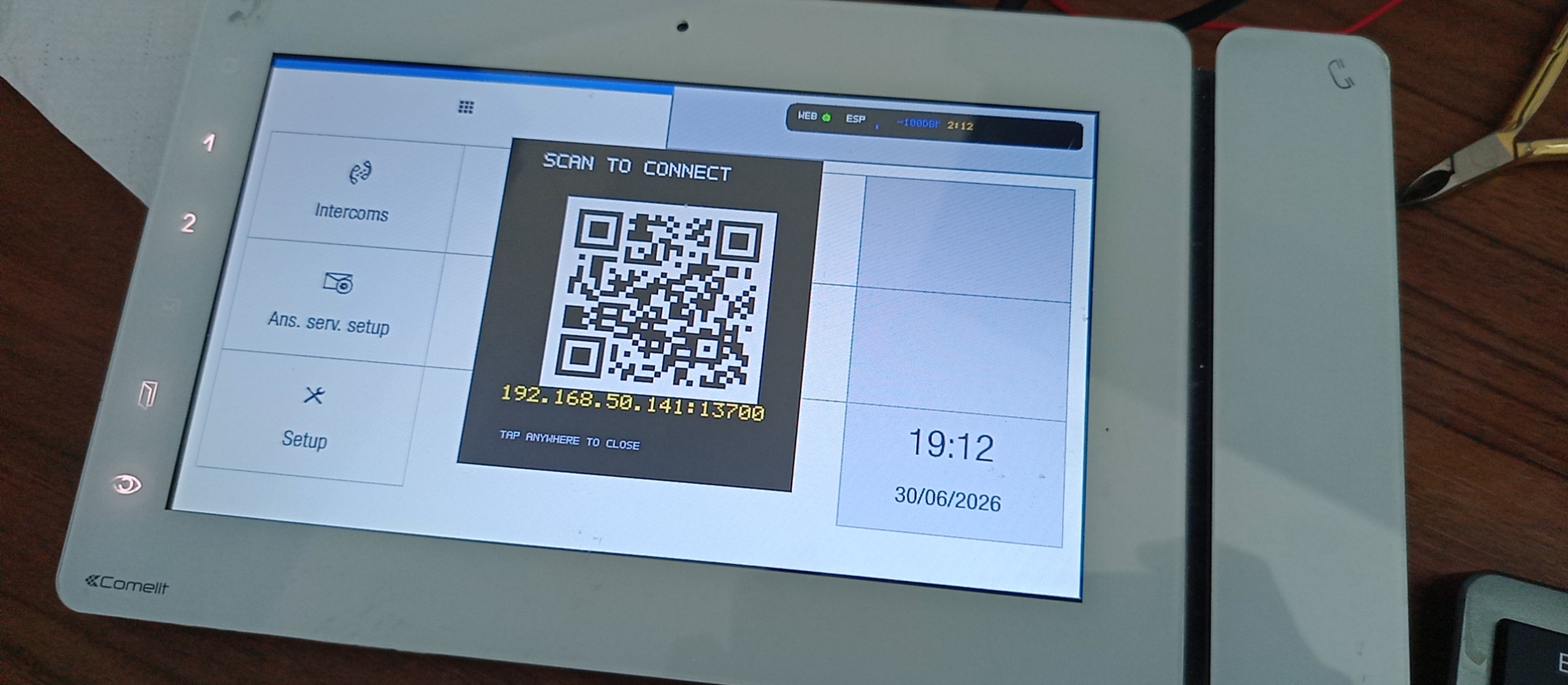 Comelit 6802W screen showing an Alpha Bits pairing QR code and connection status bar