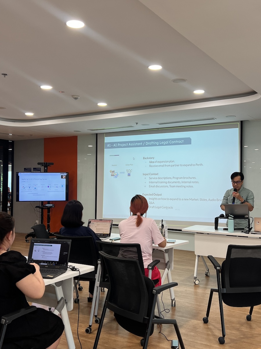 Alpha Bits AI Workshop — presenter demonstrating AI workflow tools on stage